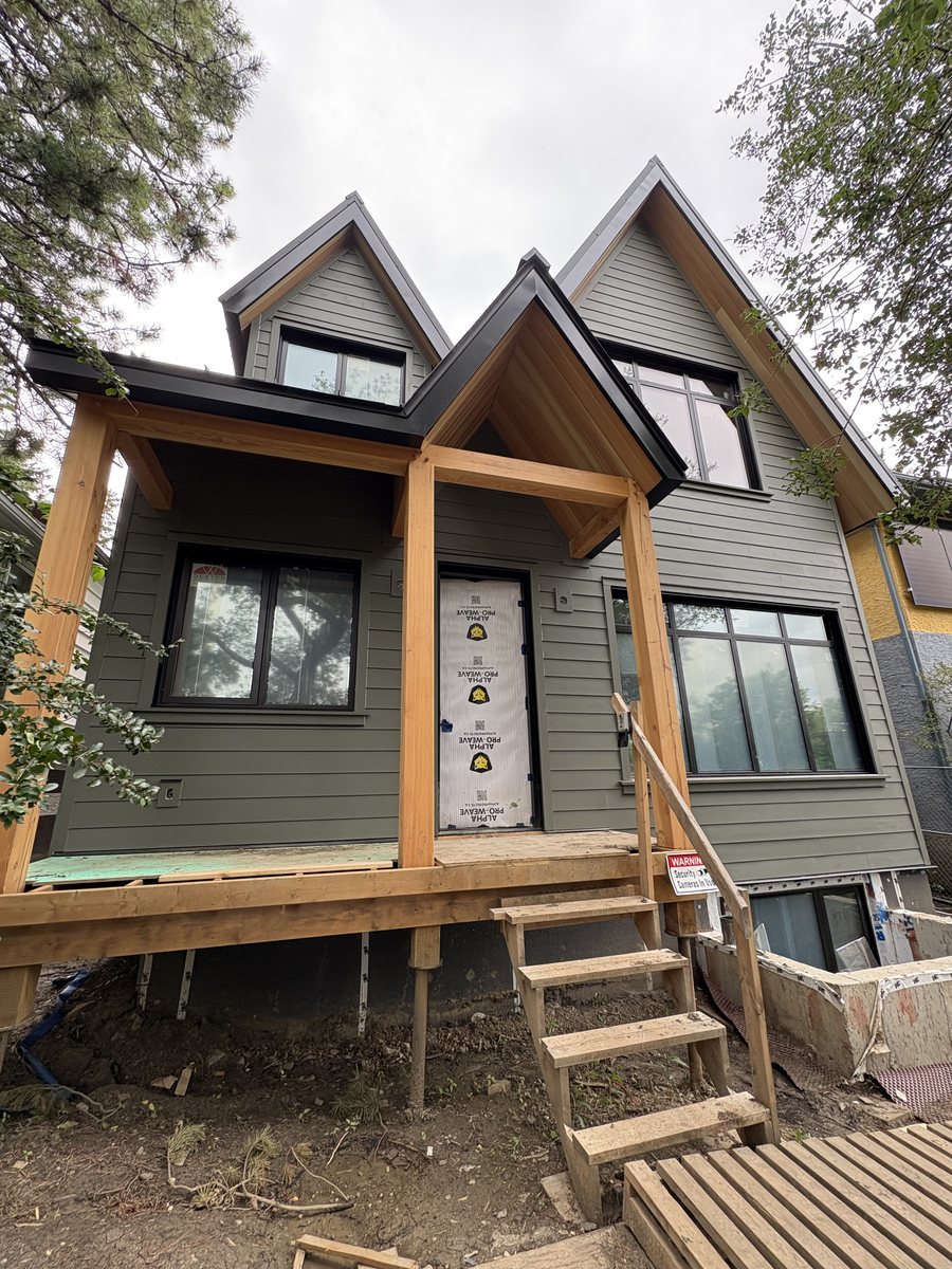 Two-story home with new siding and covered entry