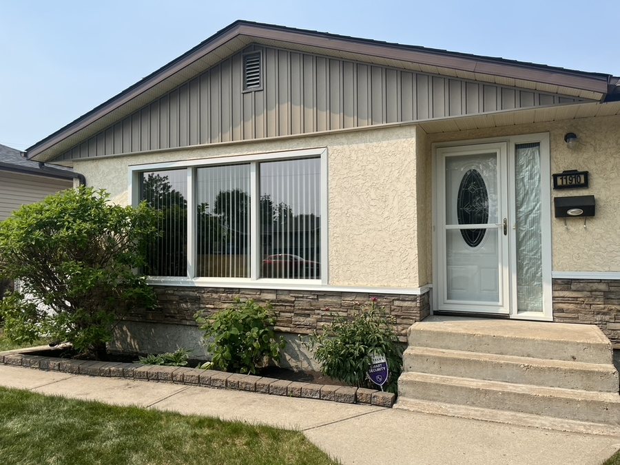 Home exterior with siding and stone accent